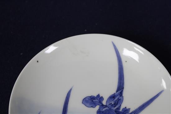 Two Japanese porcelain saucer dishes, decorated with irises and flowering trees, diameter 15.5cm